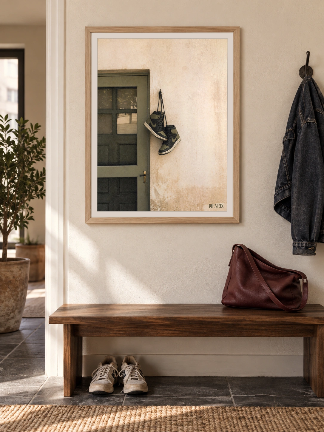 Home at Last print, 18 × 24 inch, Natural Wood frame above a hallway bench