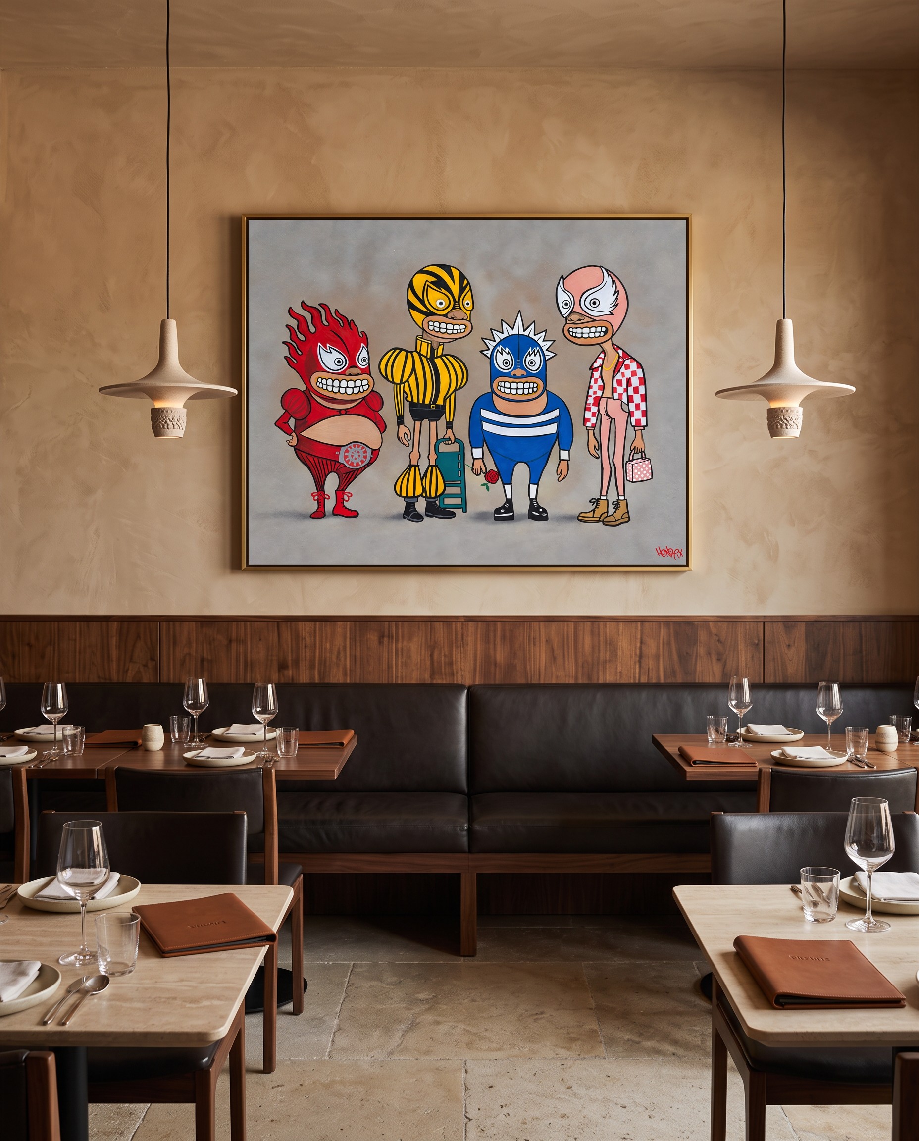 Luchadores original painting above a black leather restaurant banquette, with pottery pendant lights and set dining tables.