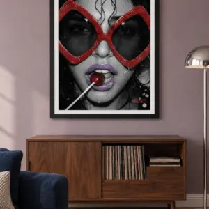 Sugar and Spice print, 18 × 24 inch, black frame above a record cabinet on a muted lilac wall