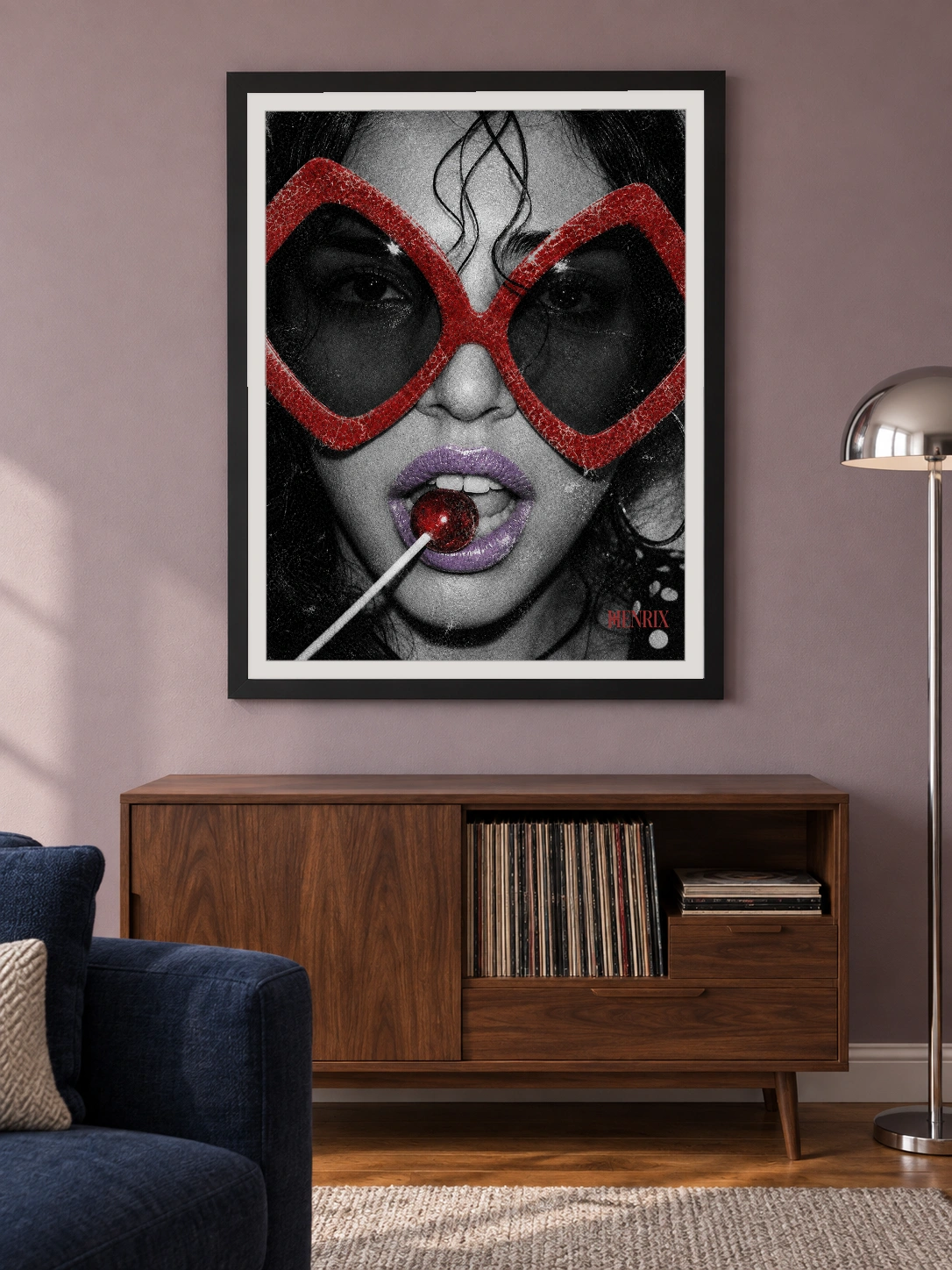 Sugar and Spice print, 18 × 24 inch, black frame above a record cabinet on a muted lilac wall