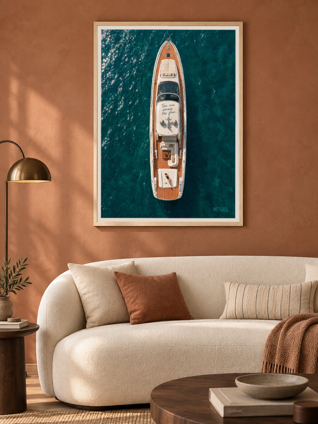 This Was Always the Plan print, 30 × 40 inch, Natural Wood frame above a cream sofa on a warm terracotta wall