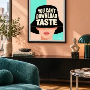 You Can't Download Taste print, 18 × 24 inch, black frame above a console with teal living-room seating