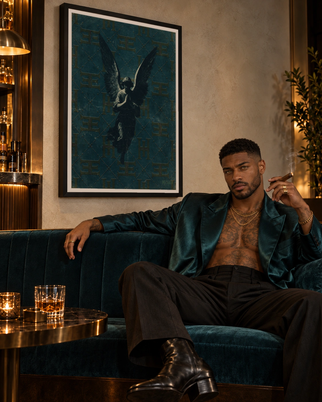 A Prayer in the Dark print, 30 × 40 inch, black frame above a green velvet sofa beside a seated man holding a cigar, viewed at an angle