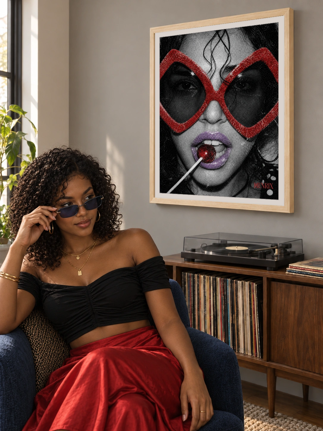 Sugar and Spice print, 18 × 24 inch, Natural Wood frame above a woman in a black top and red skirt adjusting her glasses