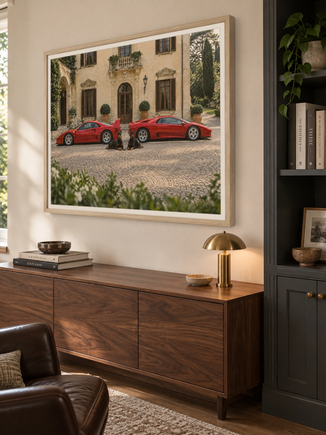 The Watchdogs print, 40 × 30 inch, Natural Wood frame above a wood console in an office, viewed at an angle