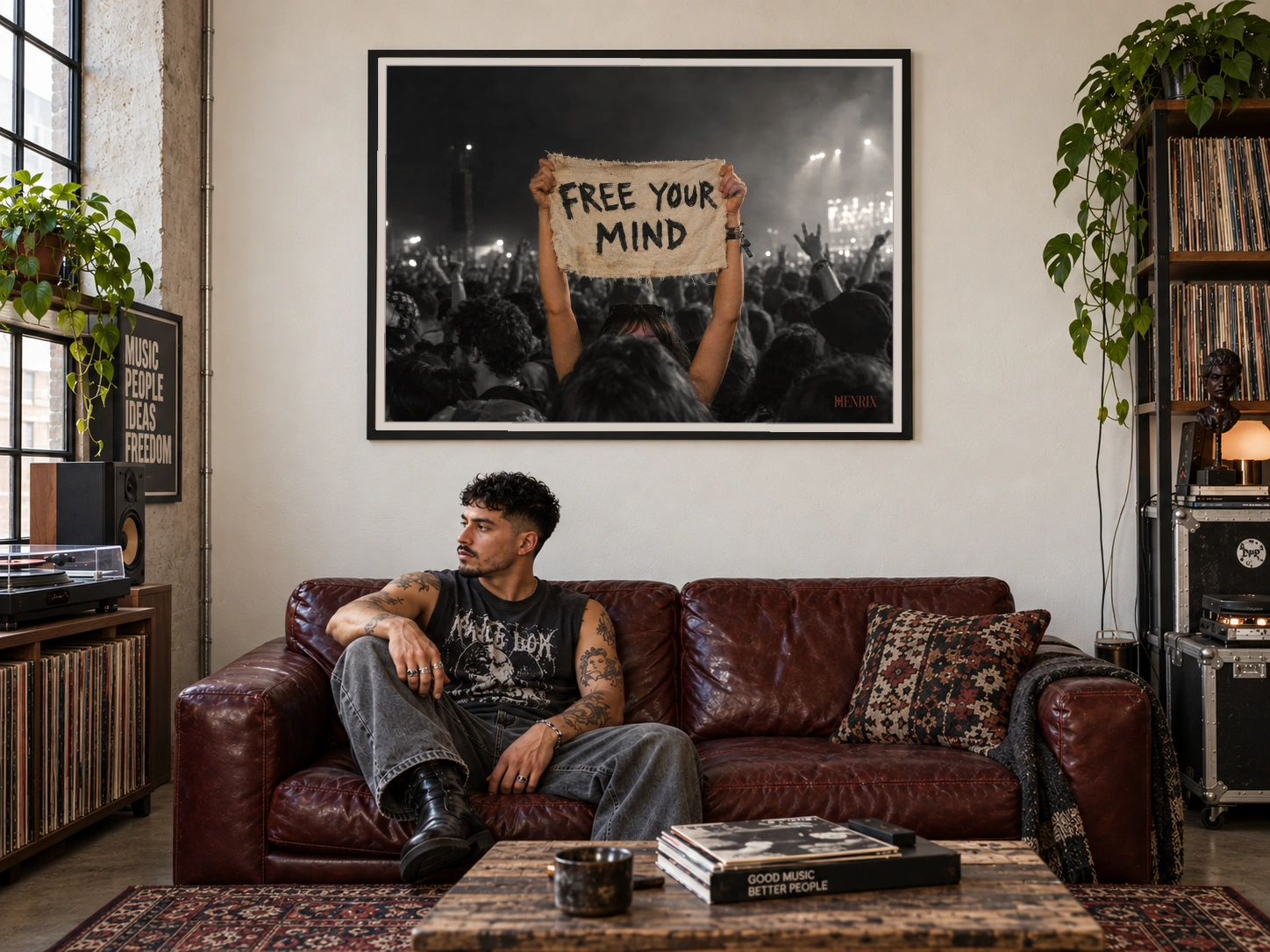 Free Your Mind print, 48 × 36 inch, black frame behind a man seated on a burgundy leather sofa