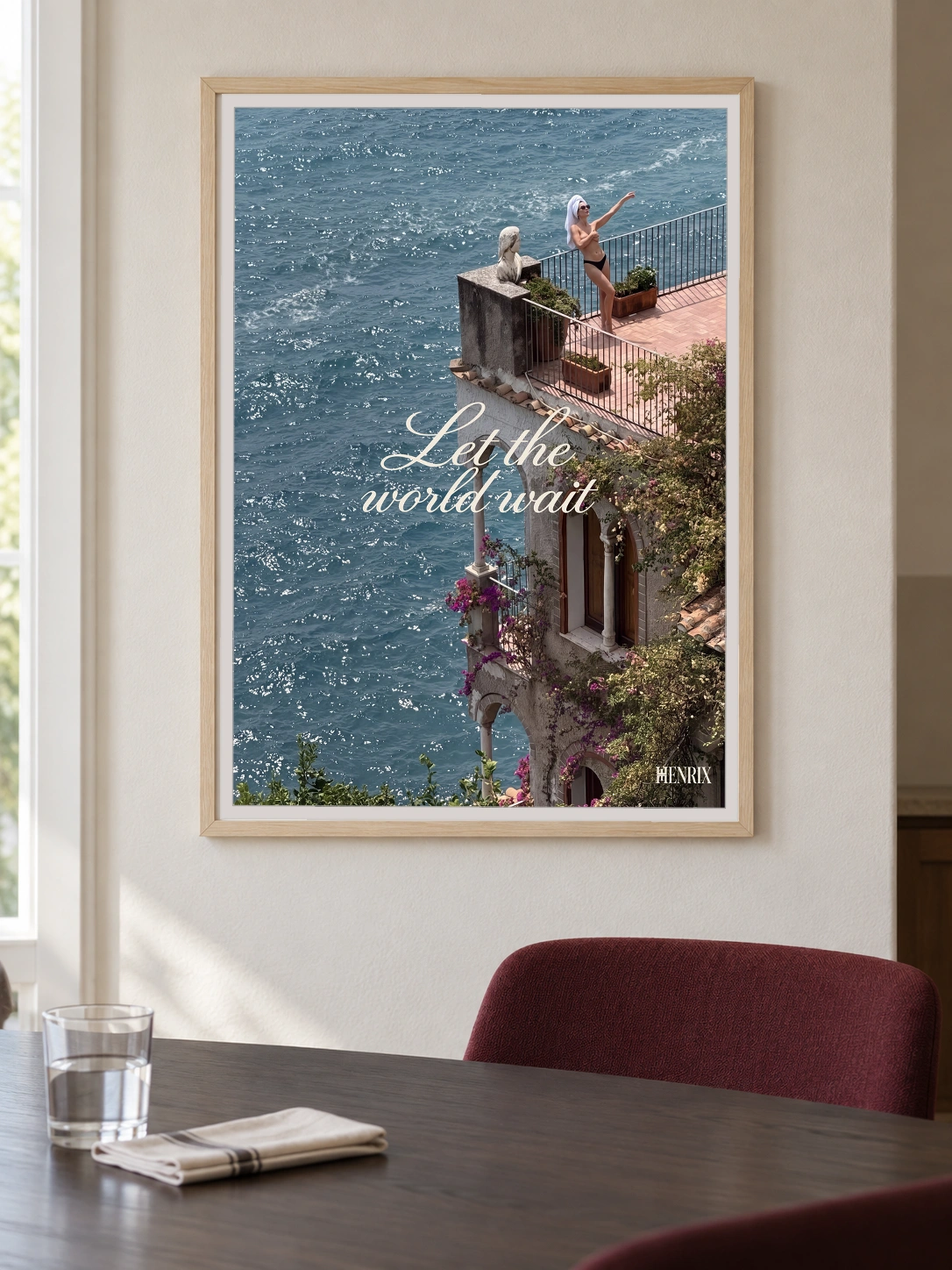 Let the World Wait print, 30 × 40 inch, Natural Wood frame on a dining-room wall above a dark table