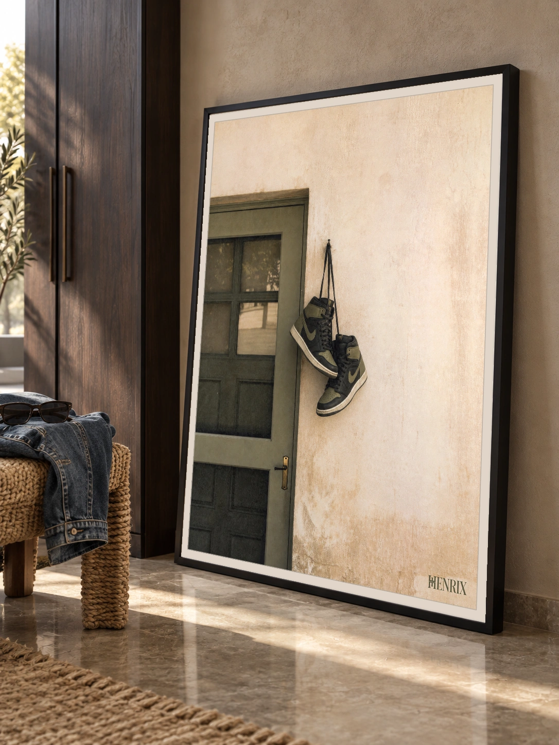 Home at Last print, 30 × 40 inch, black frame leaning on a hallway floor, viewed at an angle