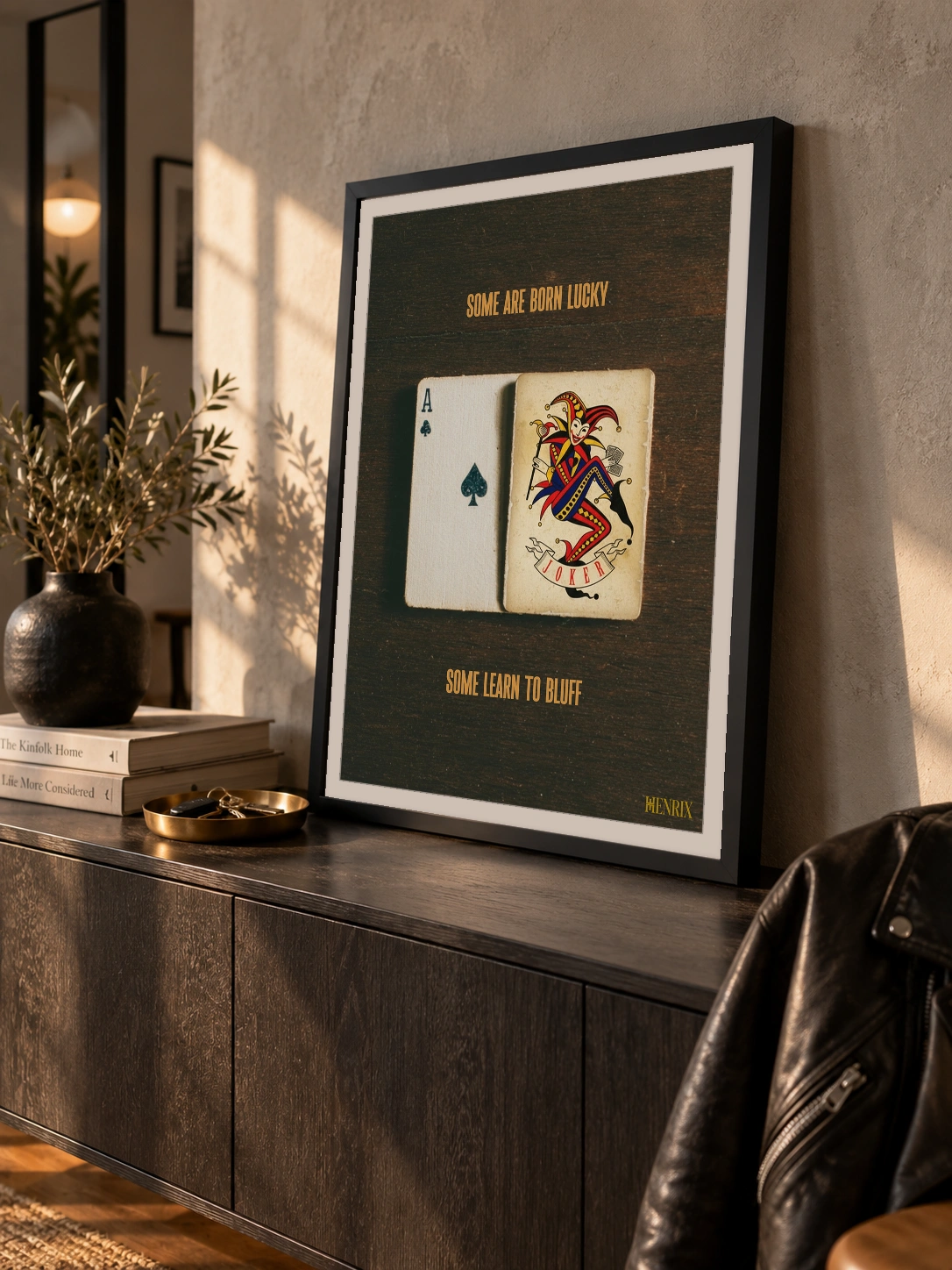 Lucky Bluff print, 18 × 24 inch, black frame leaning on a dark cabinet in afternoon light