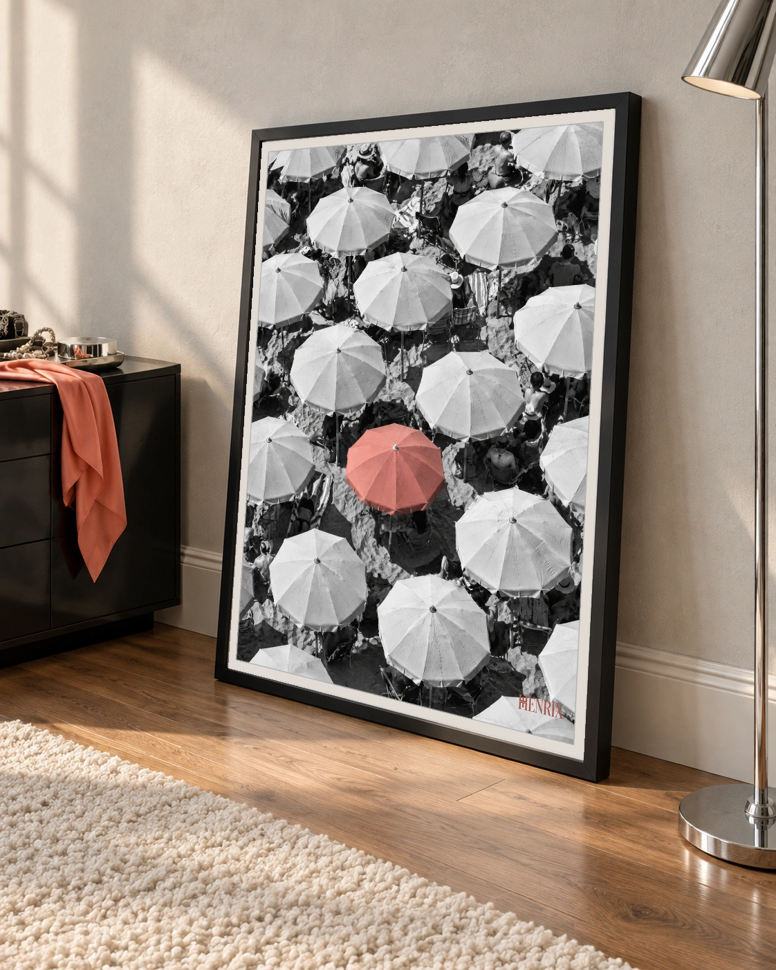You Were Never Meant to Blend In print, 30 × 40 inch, black frame leaning on a living-room floor, viewed at an angle