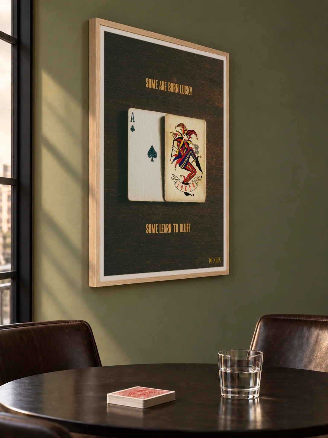 Lucky Bluff print, 30 × 40 inch, Natural Wood frame above a poker table on a green wall, viewed from the side